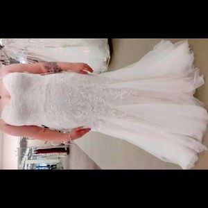 David’s bridal size 22 I wear a 16 and fits perfectly only tired on NWT OBO